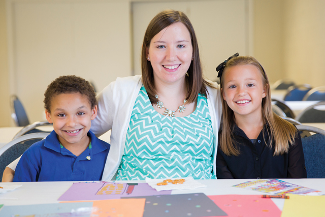Brittany Perkins ’15 balances her Longwood studies with her duties as a youth pastor at Glenn Memorial Baptist Church in Prospect. RyenToney and Emily Kelley are among the children she works with at the church.