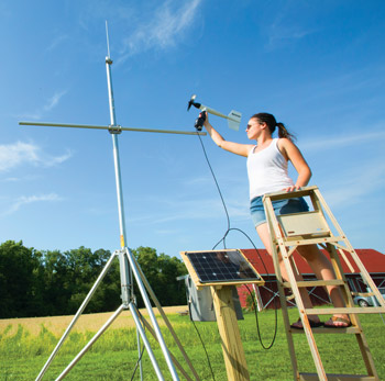 Rachel Lombardi ’16 helps install the air data-collecting station for the Longwood Environmental Observatory at Hull Springs Farm.