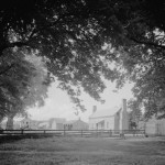 A view of the work yard featuring one of the original slave dwellings at Bacon's Castle in Surry County. Courtesy Library of Congress.