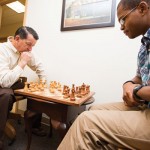 Physics professor and former Cook-Cole College of Arts and Sciences Dean Chuck Ross considers an opening move against senior history major Alex Morton.