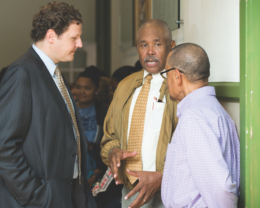 President W. Taylor Reveley IV talks with Everett Berryman Jr. (center) and Farmville Vice Mayor Chuckie Reid (right) during the opening reception for the exhibition Their Voices at the Moton Museum in April.