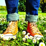 Feet in Sneakers standing in a grassy field