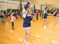 Cheerleaders teach a routine